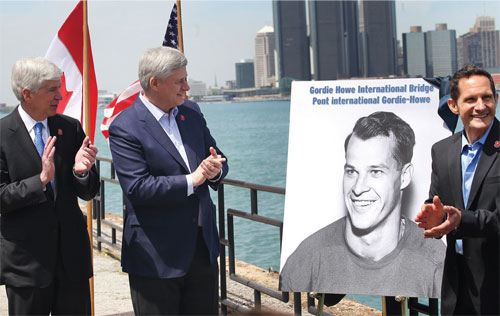 Prime Minister Stephen Harper, joined by Rick Snyder, Governor of Michigan, and Murray Howe, announces that the future publicly-owned bridge between Windsor, Ontario, and Detroit, Michigan, will be named the Gordie Howe International Bridge, in honour of hockey legend Gordie Howe.