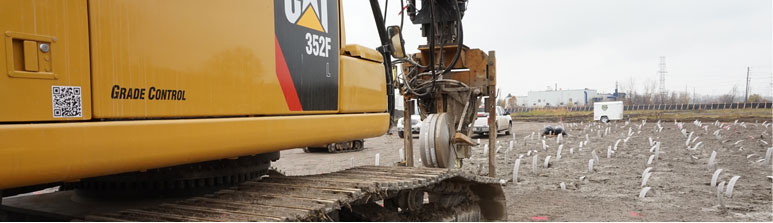 Heavy equipment is used to install the wick drain