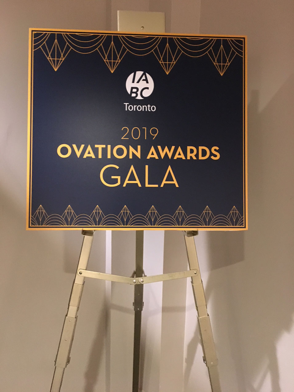 Blue sign reading IABC Toronto 2019 Ovation Awards Gala 