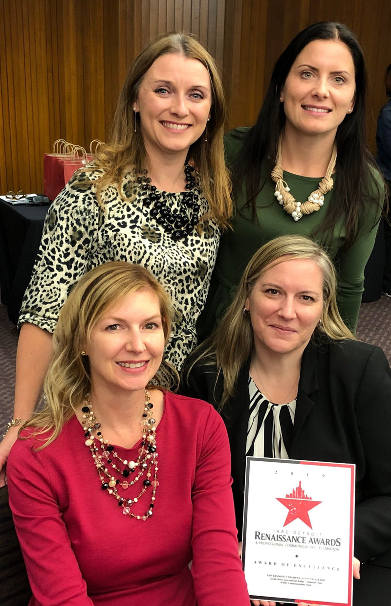 Four women from WDBA's Communications Team accept the IABC Detroit Renaissance Award
