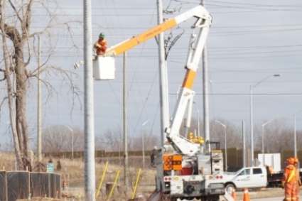Worker performing utility line maintenance 